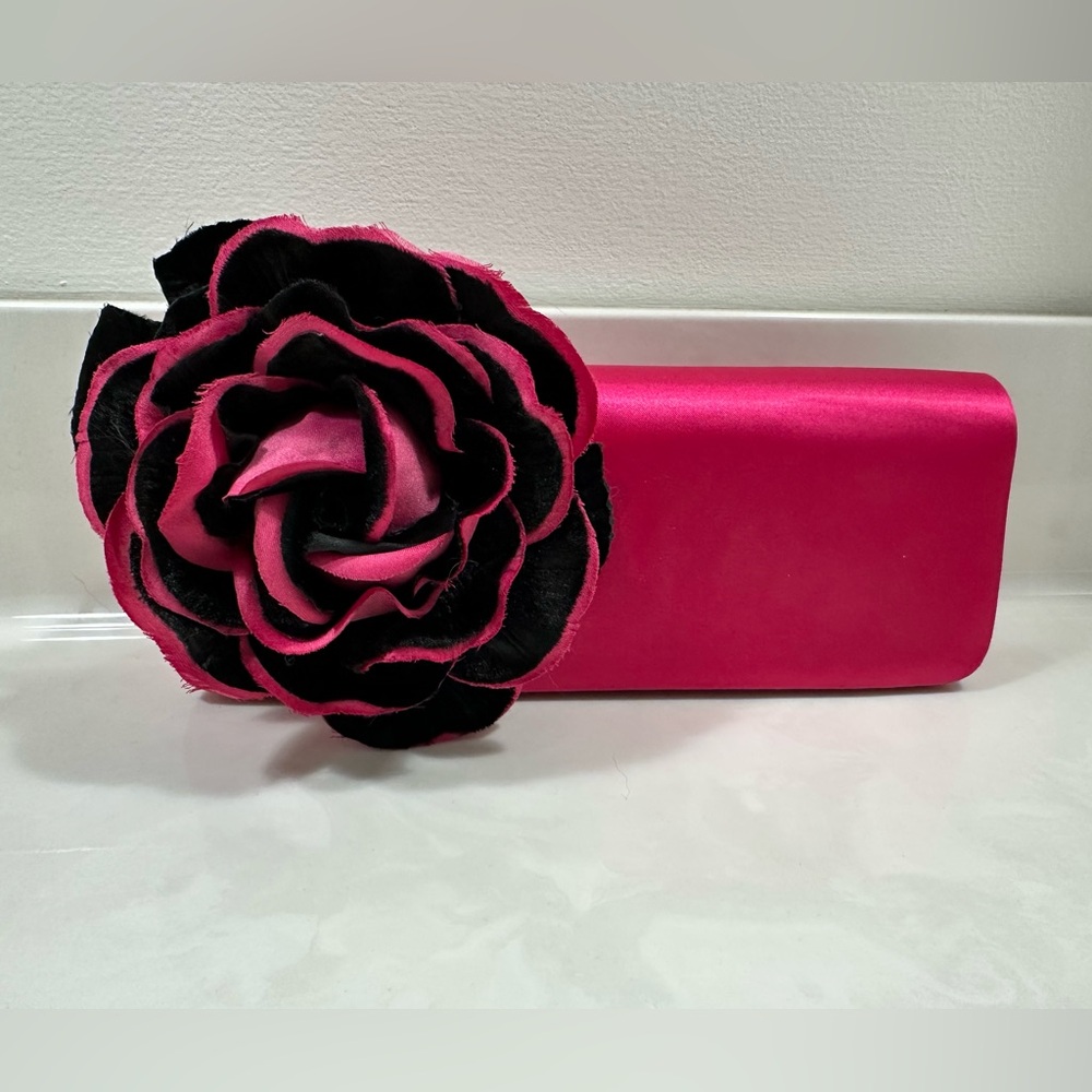 Pink satin clutch with large black and pink rosette